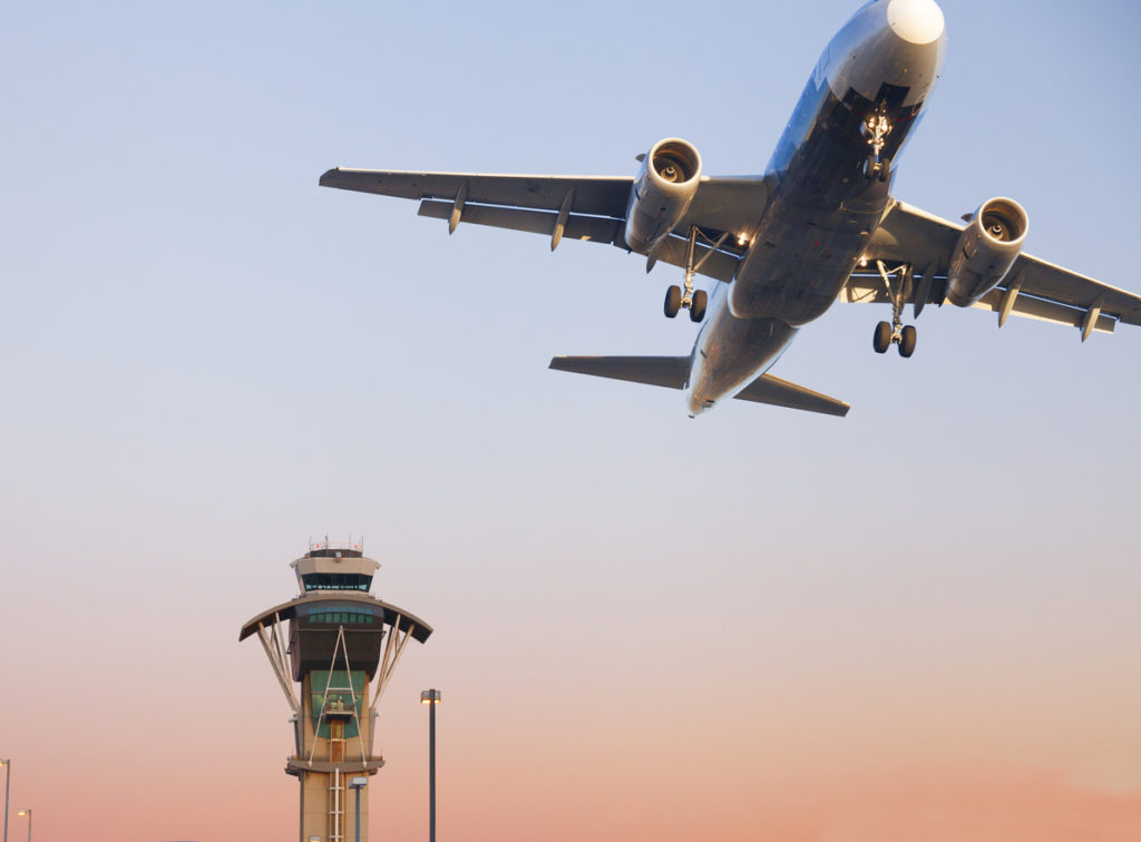 Air Trafic Control tower and airplane at Los Angeles International Airport