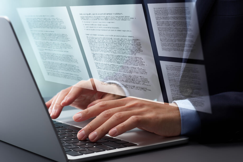 Person writing out a statement on a laptop.